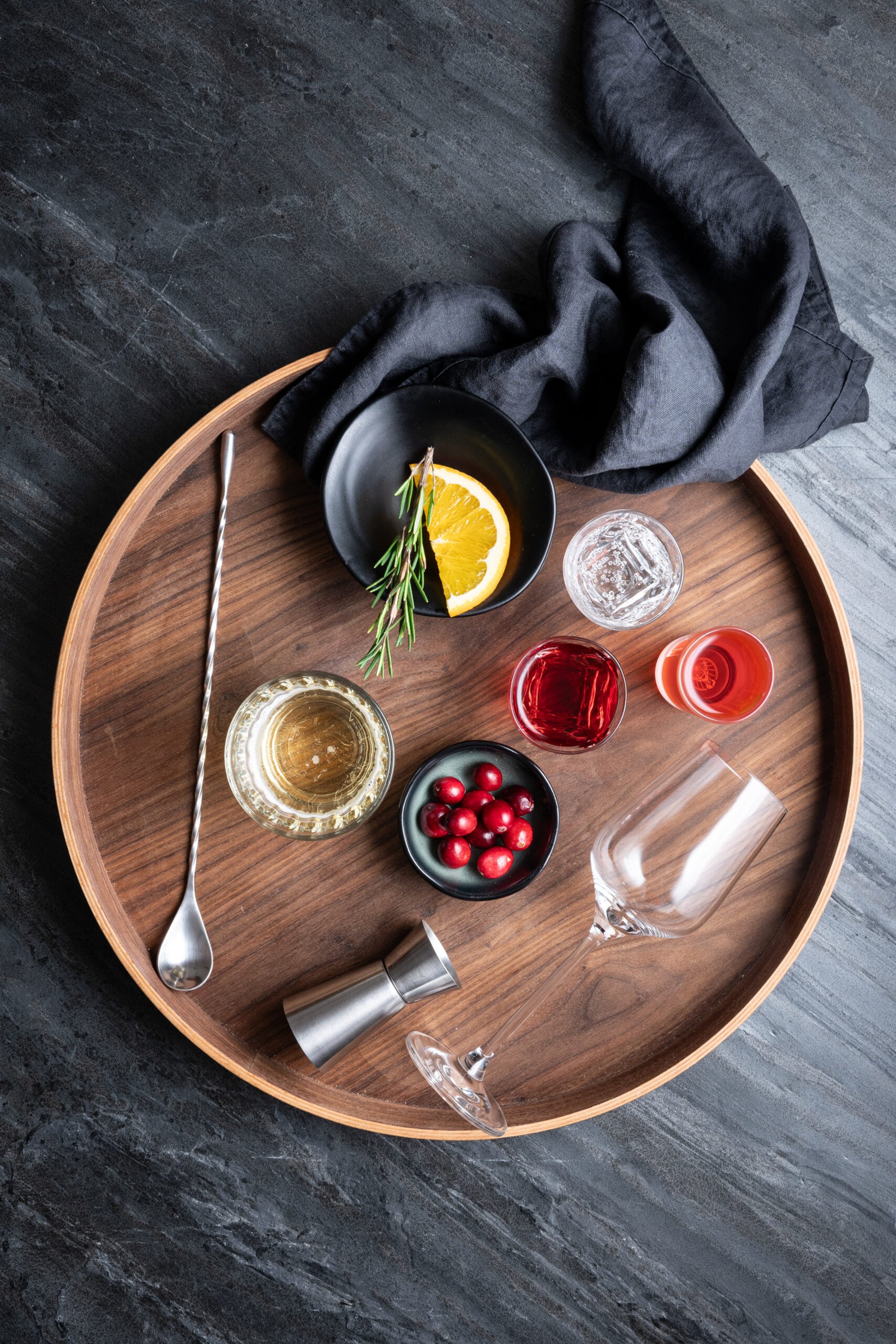Cranberry Aperol Spritz ingredients on a tray shot from above