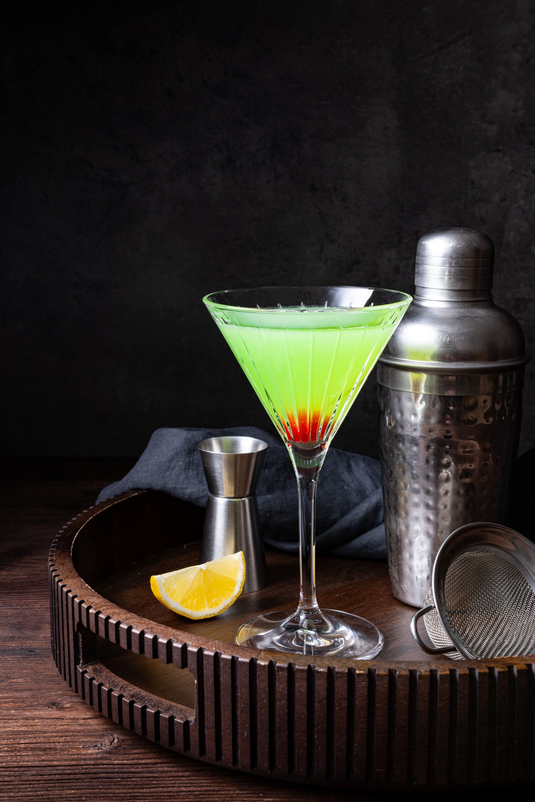 Japanese Slipper Cocktail in a glass shot from the side