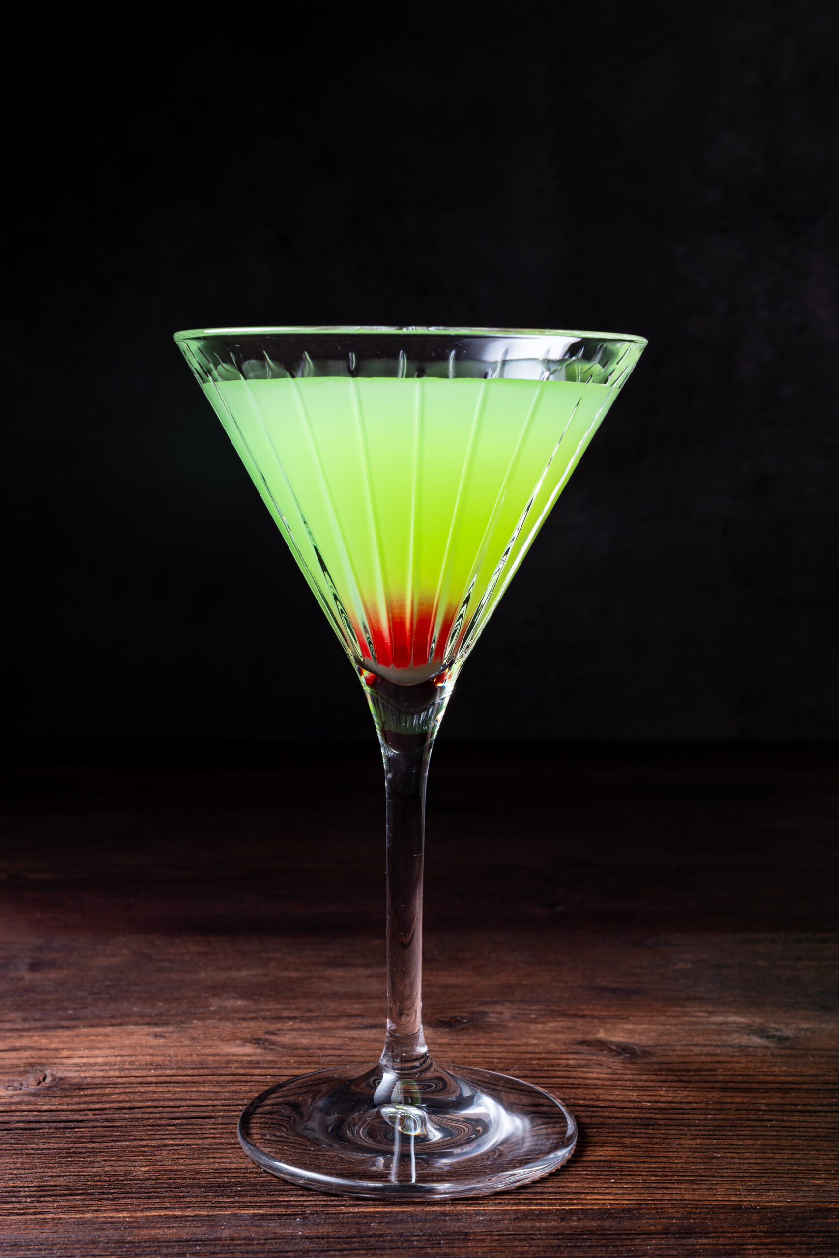 Japanese Slipper Cocktail in a glass shot from the side