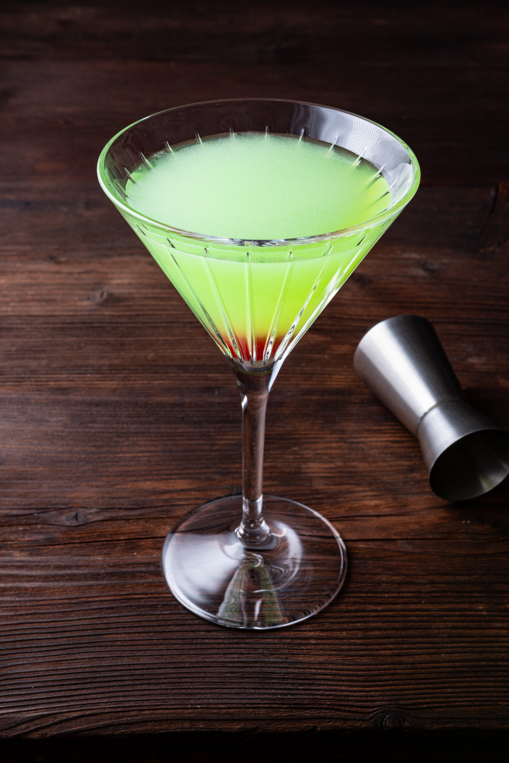 Japanese Slipper Cocktail in a glass diagonal shot