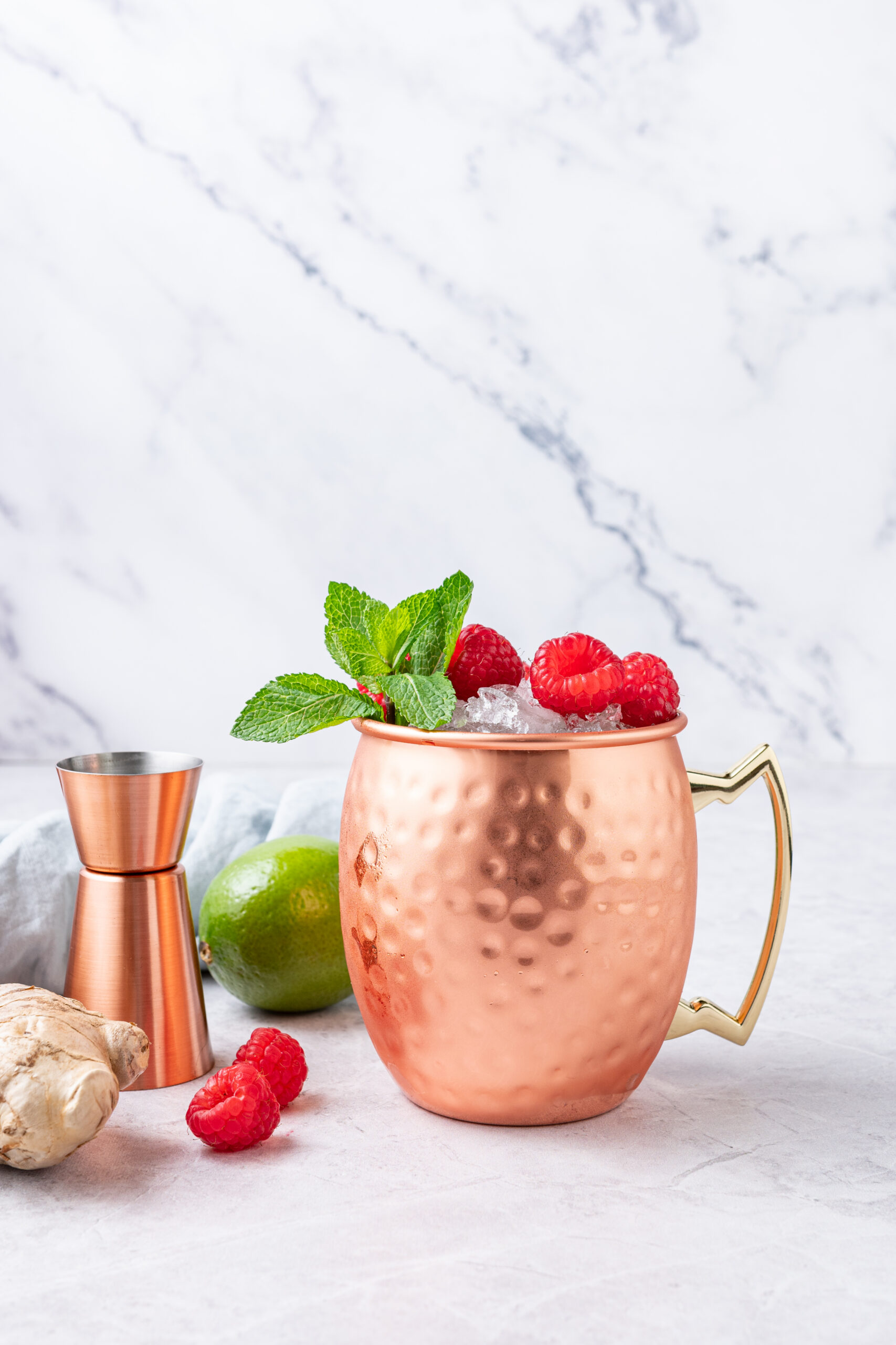 Raspberry Moscow Mule in a copper mug shot from the side