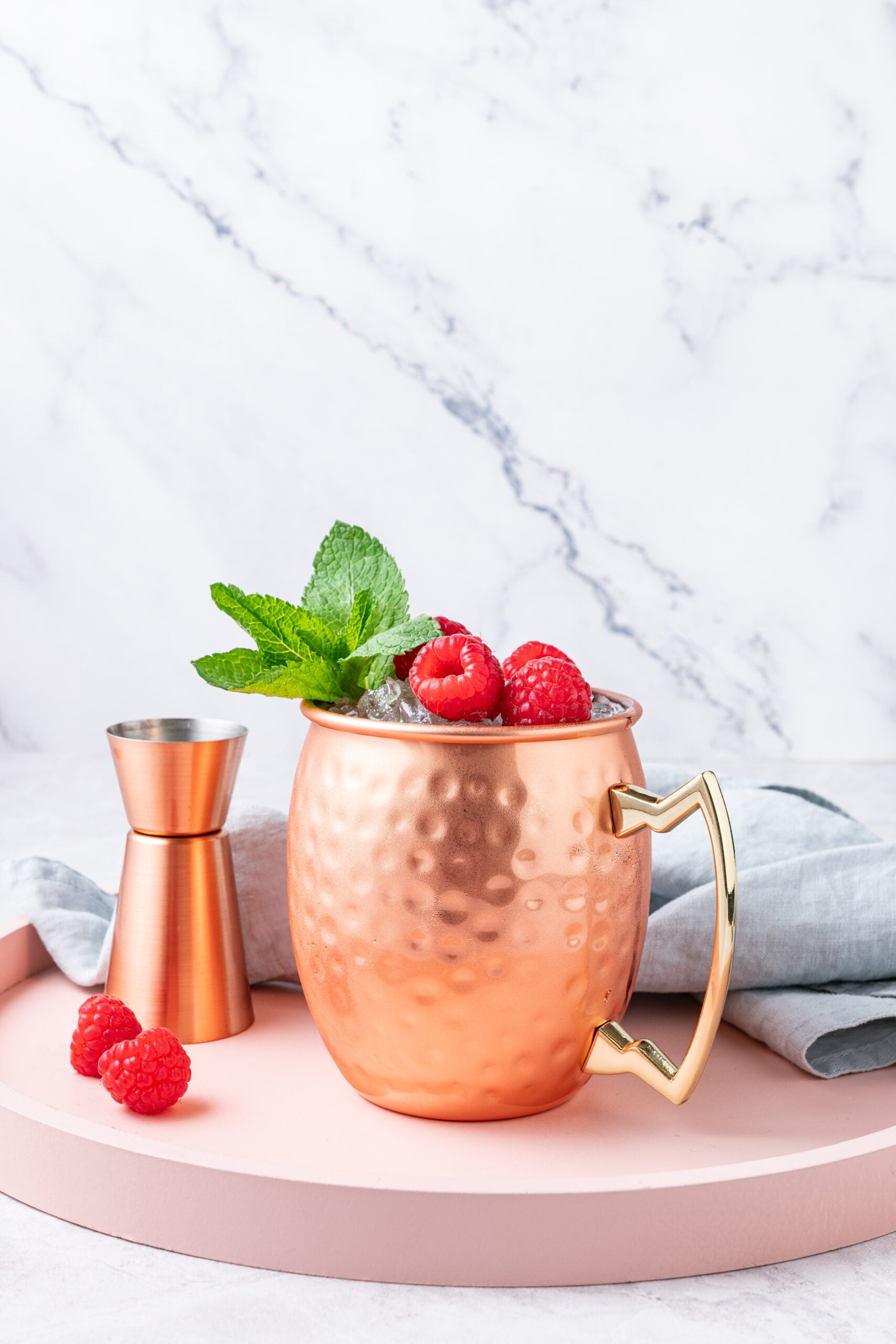 Raspberry Moscow Mule in a copper mug shot from the side