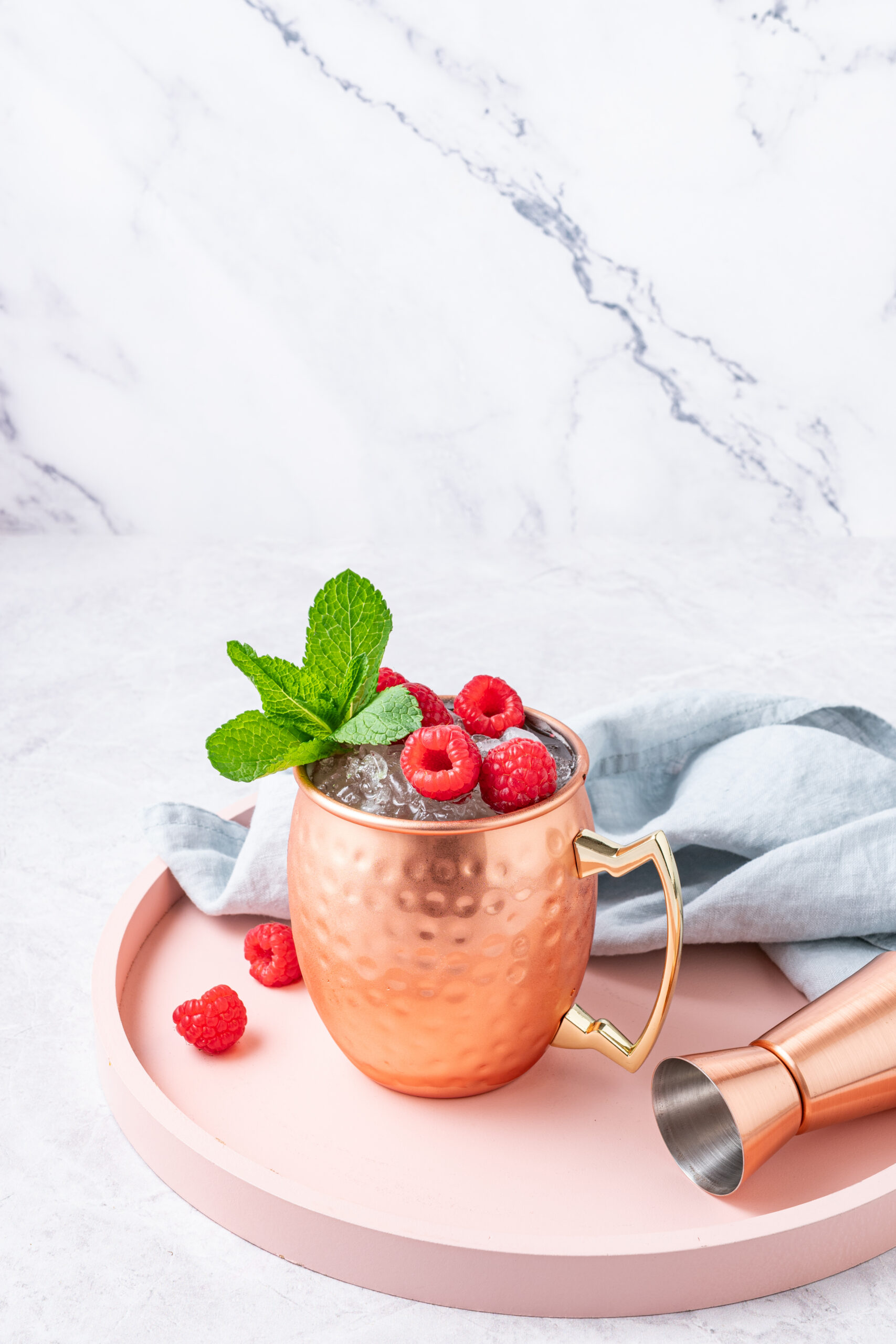 Raspberry Moscow Mule in a copper mug diagonal shot