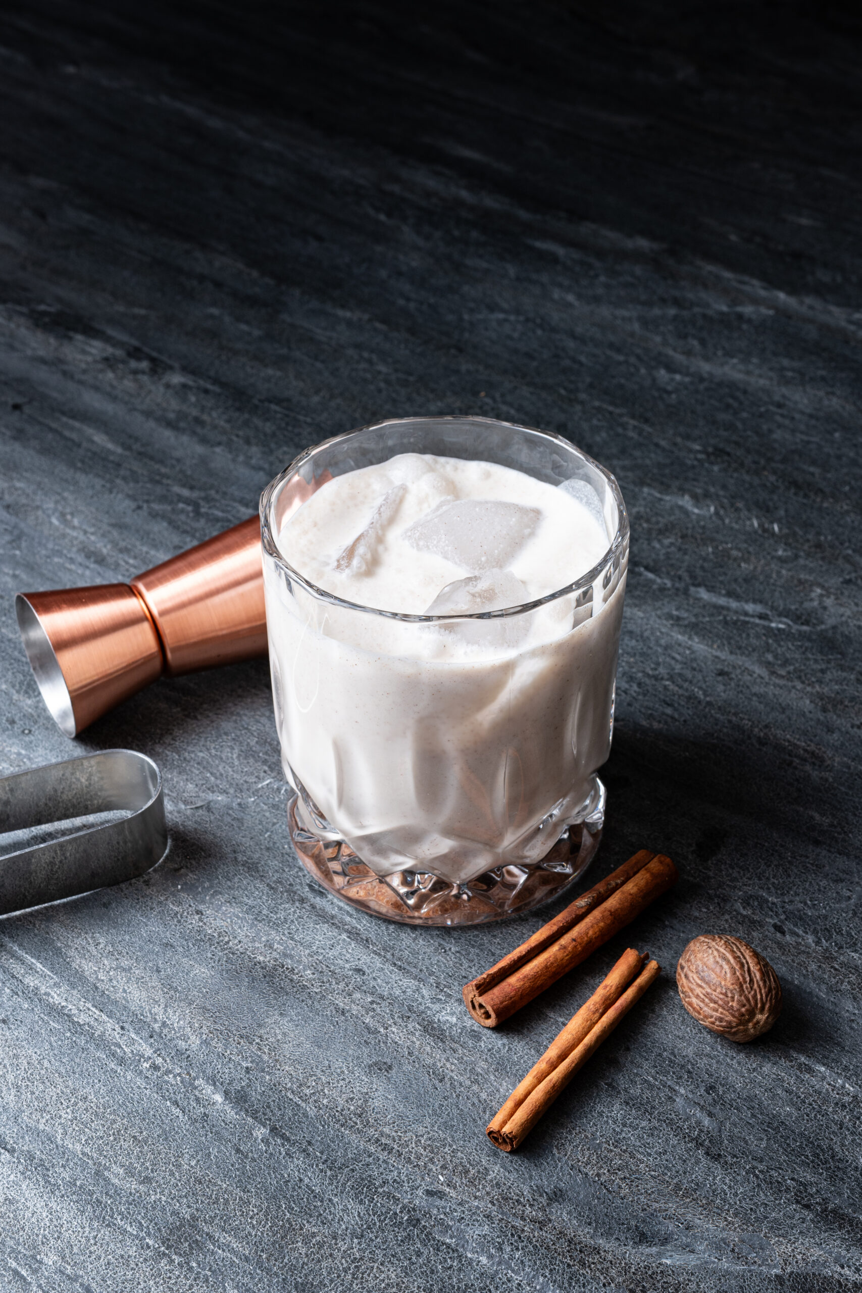 RumChata served in a glass with ice diagonal shot